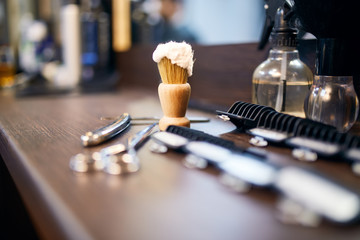 Barber tools lying on the table at barber shop. Barber background