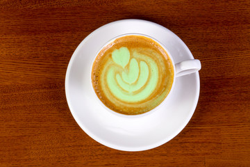 Green cappuccino with cream