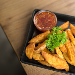 French fries, chips, finger chips are cut deep-fried potatoes,Common fast food served with tomato sauce, ketchup, vinegar, mayonnaise