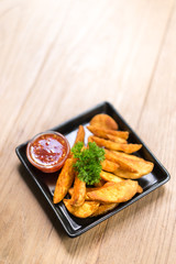 fried potatoes on wood table,top view.