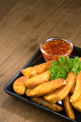 French fries, chips, finger chips are cut deep-fried potatoes,Common fast food served with tomato sauce, ketchup, vinegar, mayonnaise