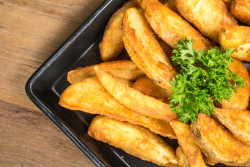 French fries, chips, finger chips are cut deep-fried potatoes,Common fast food served with tomato sauce, ketchup, vinegar, mayonnaise