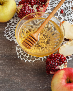 Rosh Hashanah concept, honey, apple, pomegranate