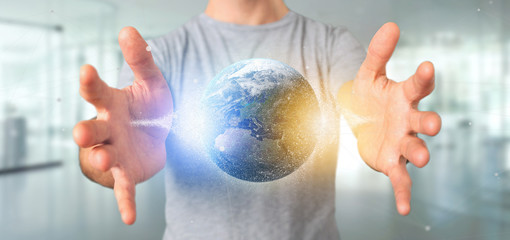 Man holding a 3d rendering particles earth globe
