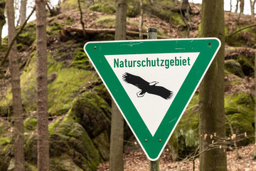 sign with german text Naturschutzgebiet, in english nature reserve