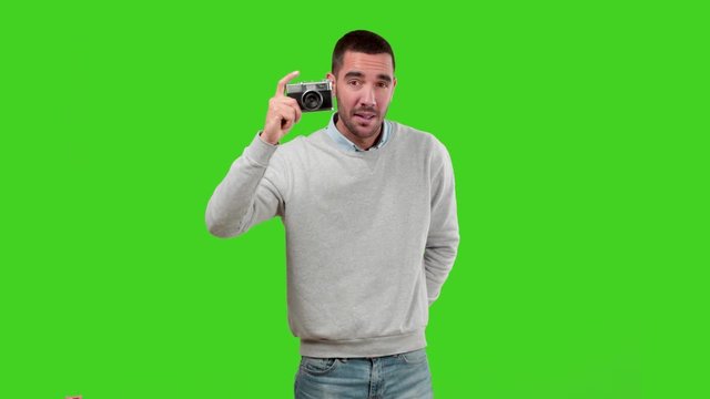 Happy guy using a vintage camera