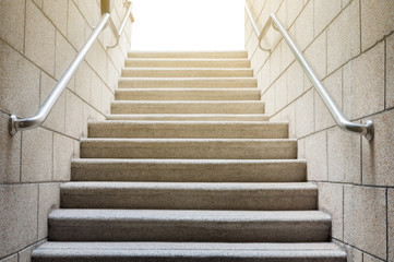 Fototapeta na wymiar Concrete stairs with stainless handrail with sun rise, business conception success and growth in work career, way to successful business.