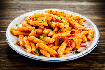 Penne with meat, tomato sauce and vegetables