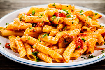 Penne with meat, tomato sauce and vegetables