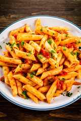 Penne with meat, tomato sauce and vegetables