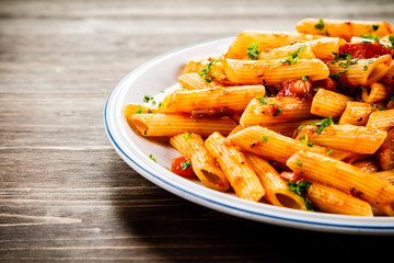 Penne with meat, tomato sauce and vegetables