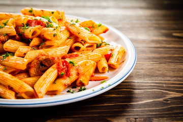 Penne with meat, tomato sauce and vegetables