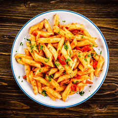 Penne with meat, tomato sauce and vegetables