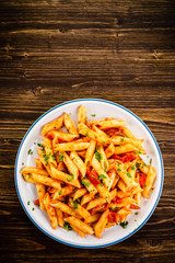 Penne with meat, tomato sauce and vegetables