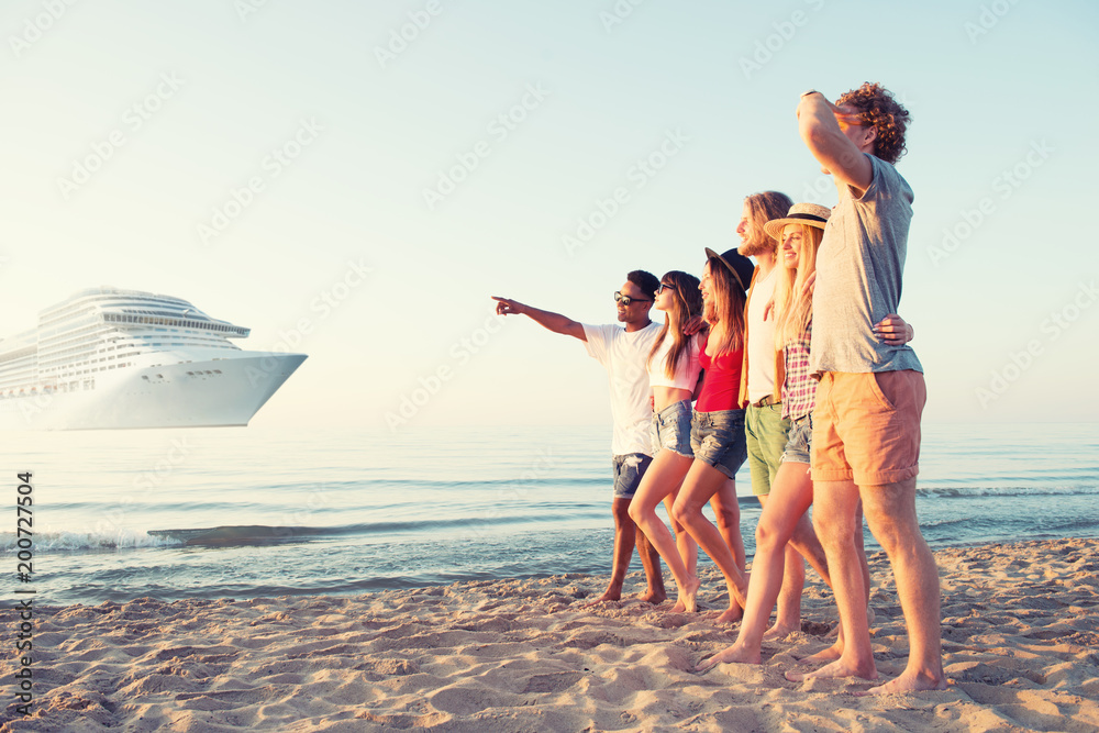 Wall mural Group of happy friends having fun at ocean beach. Travel with cruiseship concept