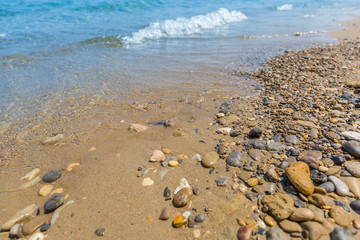 Rocks and soft waves on sea coast