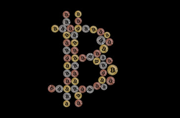 Bitcoin sign made of physical coins isolated on black background.