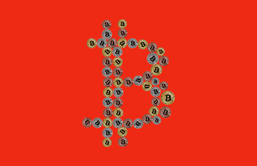 Bitcoin sign made of physical coins isolated on red background.