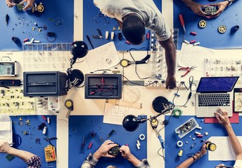 Aerial view of electronics technicians team - obrazy, fototapety, plakaty