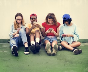 Group of diverse women with mobile phone