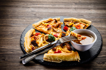 Pizza with chicken and vegetables on white background