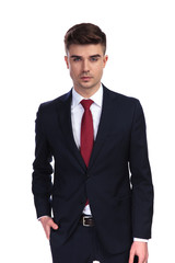 young businessman with hand in pocket