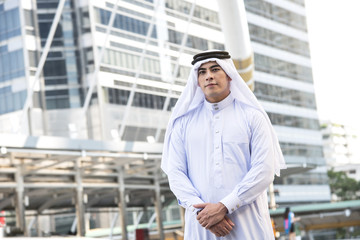 Handsome businessman arabic stand in the city.