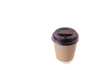 Brown carton disposable safe heat resistant double walled paper take out coffee cup to go. Colorful eco-friendly cardboard mug for hot beverages, black cap. Isolated background, close up, copy space.
