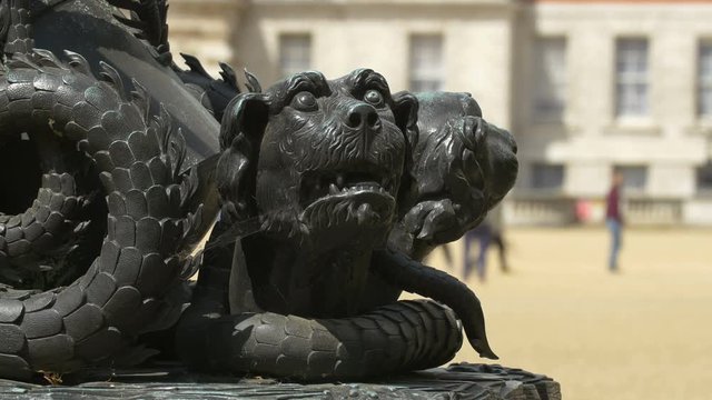 Close up of two headed creature sculpture