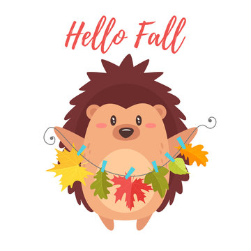 hedgehog holding autumn colorful leaves