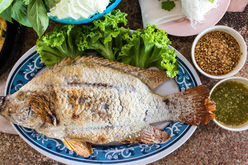 Food wrapped in leaves and Grilled  Ruby Fish.