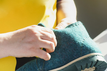 Handmade shoes. The process of making fashionable and stylish shoes from natural felted wool.
