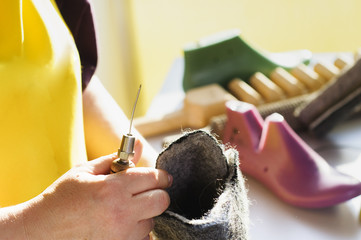 Handmade shoes. The process of making fashionable and stylish shoes from natural felted wool.