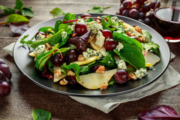 Fresh Pears, Blue Cheese salad with vegetable green mix, Walnuts, red grapes. healthy food