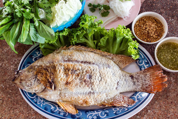 Food wrapped in leaves and Grilled  Ruby Fish.