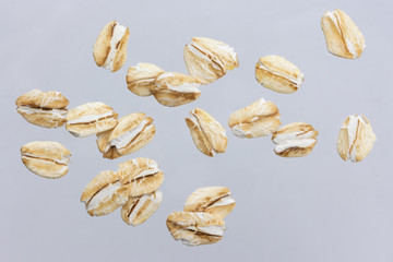 Oat flakes isolated on white background. Close up. - Powered by Adobe
