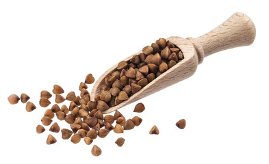 Buckwheat in wooden scoop isolated on white background