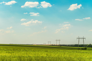 Landscape with air line supports. Intermediate steel overhead transmission line supports on a horizon.