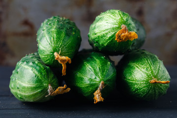ripe cucumber on rustic table