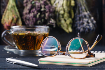 Recipe of alternative medicine with herbs and hot tea