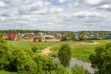 View of the village of Krivskoye, Borovskoy district, Russia. View from the high bank of the Protva River

