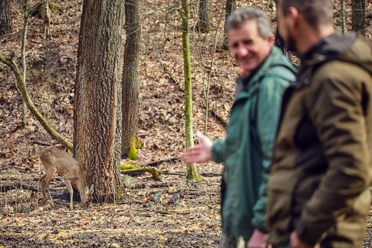 Game rangers at the feeding spot