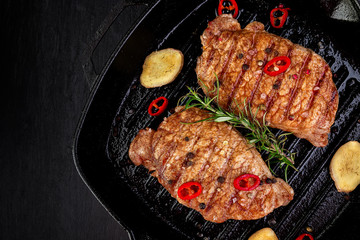 Grilled pork steak in grill pan