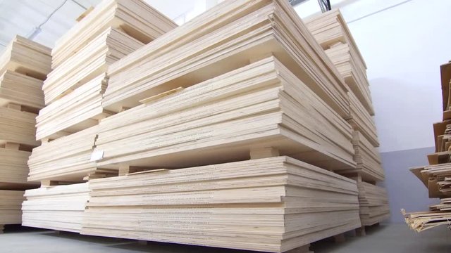 plywood in stock dolly shot ,commercial warehouse