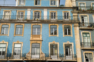 Fototapeta na wymiar Classic apartment building exterior facade in Lisbon, Portugal