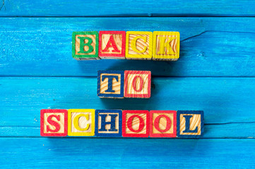 Back to school. Close up arrangement of "Back to School" alphabet on blue background. Preschool, education and copy-space concept or other your content.