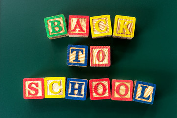 Back to school. Close up arrangement of "Back to School" alphabet on chalk board. Preschool, education and copy-space concept or other your content.