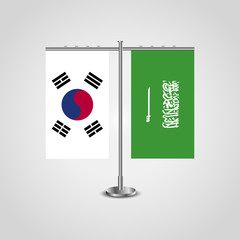 Table stand with flags of South Korea and Saudi Arabia.Two flag. Flag pole. Symbolizing the cooperation between the two countries. Table flags
