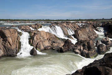 Fototapeta na wymiar Preah Rumkel Cambodia, Preah Nimith waterfall and rapids on the Mekong river along the Cambodian Lao border in dry season