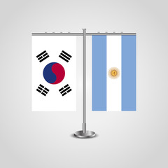 Table stand with flags of South Korea and Argentina.Two flag. Flag pole. Symbolizing the cooperation between the two countries. Table flags